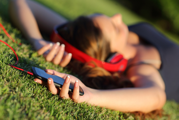 Using a sleep app in the park (Shutterstock) Using a sleep app in the park (Shutterstock)