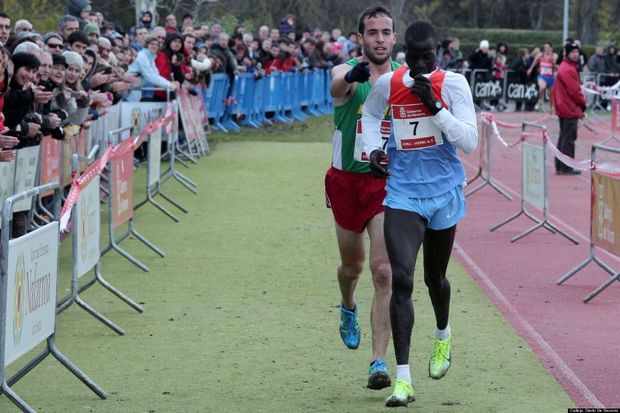 Ivan Fernandez Anaya guides Abel Mutai to the finish line Ivan Fernandez Anaya guides Abel Mutai to the finish line