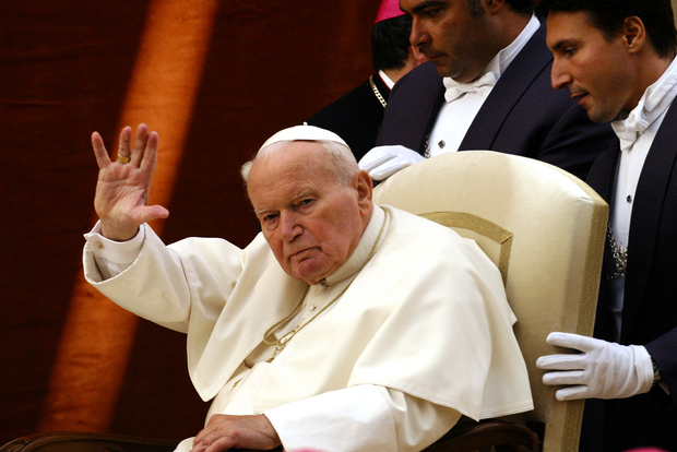 Pope John Paul II greets pilgrims in 2004 Pope John Paul II greets pilgrims in 2004