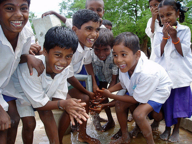 Water.org beneficiaries enjoying a new hand pump Water.org beneficiaries enjoying a new hand pump