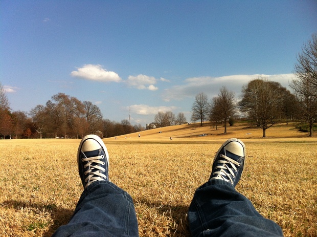 Listening to relaxing music in a field Listening to relaxing music in a field