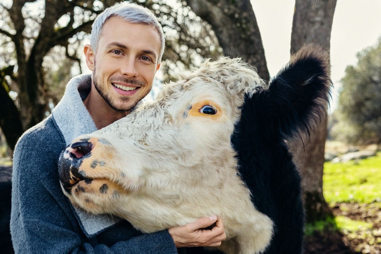 Nathan Runkle poses with a rescued cow Nathan Runkle poses with a rescued cow