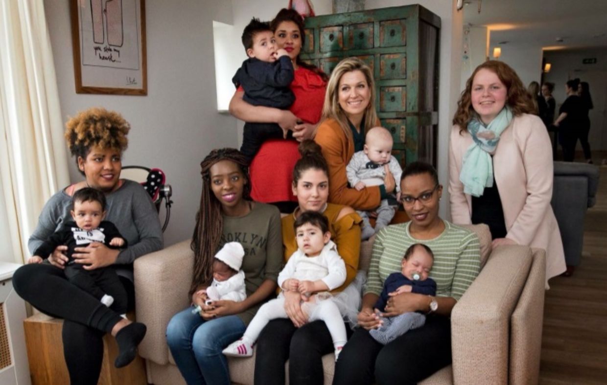 Queen Máxima of the Netherlands sits with young mothers at the Baby House in Dordrecht Queen Máxima of the Netherlands sits with young mothers at the Baby House in Dordrecht