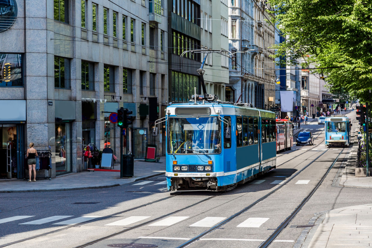 Modern blue tram in Oslo in Norway in a summer day Modern blue tram in Oslo in Norway in a summer day