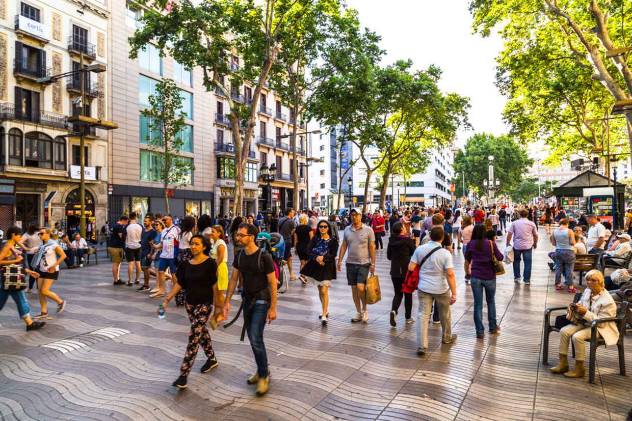 Hundreds of tourists from all over the world visit and stroll the streets of Barcelona Hundreds of tourists from all over the world visit and stroll the streets of Barcelona