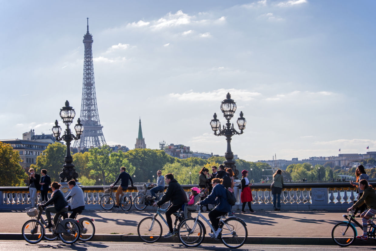 People on bicycles and pedestrians enjoying a car-free day on Alexandre III bridge on September 27, 2015 in Paris, France People on bicycles and pedestrians enjoying a car-free day on Alexandre III bridge on September 27, 2015 in Paris, France