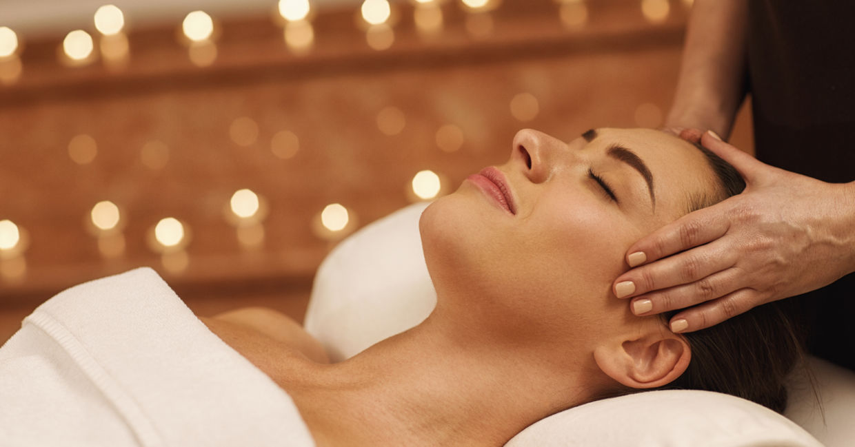 Massagist with woman patient in aroma spa wellness center. Professional face lifting massage to beautiful girl in cosmetology cabinet or beauty parlor. Massagist with woman patient in aroma spa wellness center. Professional face lifting massage to beautiful girl in cosmetology cabinet or beauty parlor.