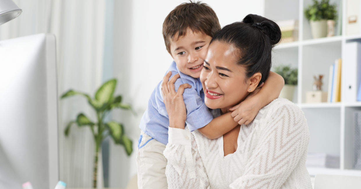 A boy hugs his mother A boy hugs his mother