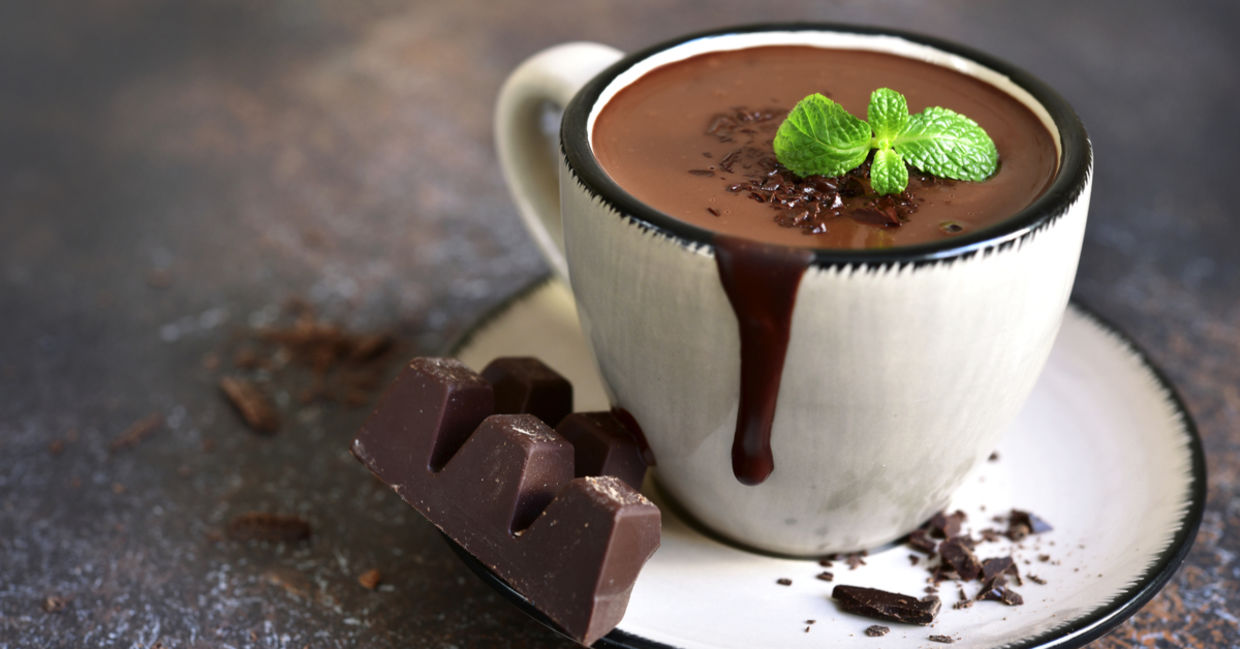 A delicious mug of peppermint hot cocoa topped is with a refreshing mint leaf. A delicious mug of peppermint hot cocoa topped is with a refreshing mint leaf.
