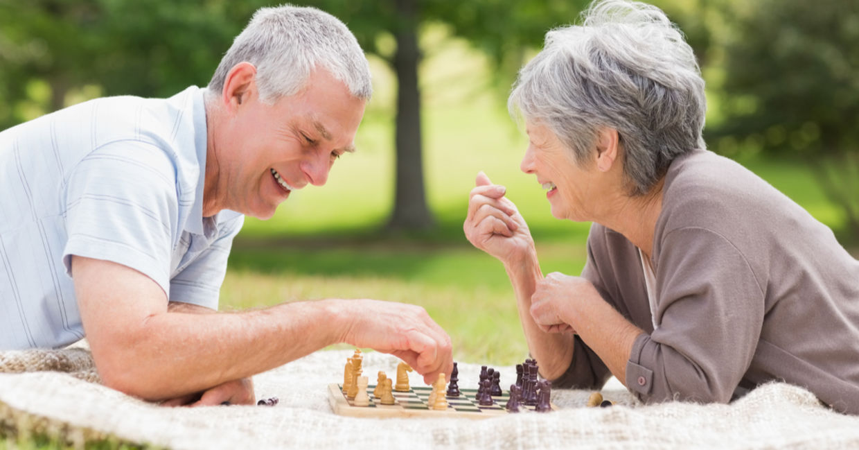 Retired couple playing chess, a brain game. Retired couple playing chess, a brain game.
