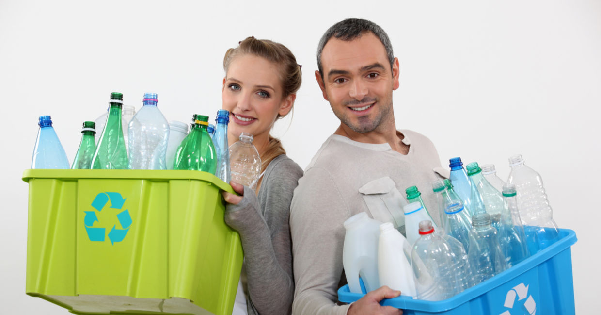 Happy couple recycling Happy couple recycling