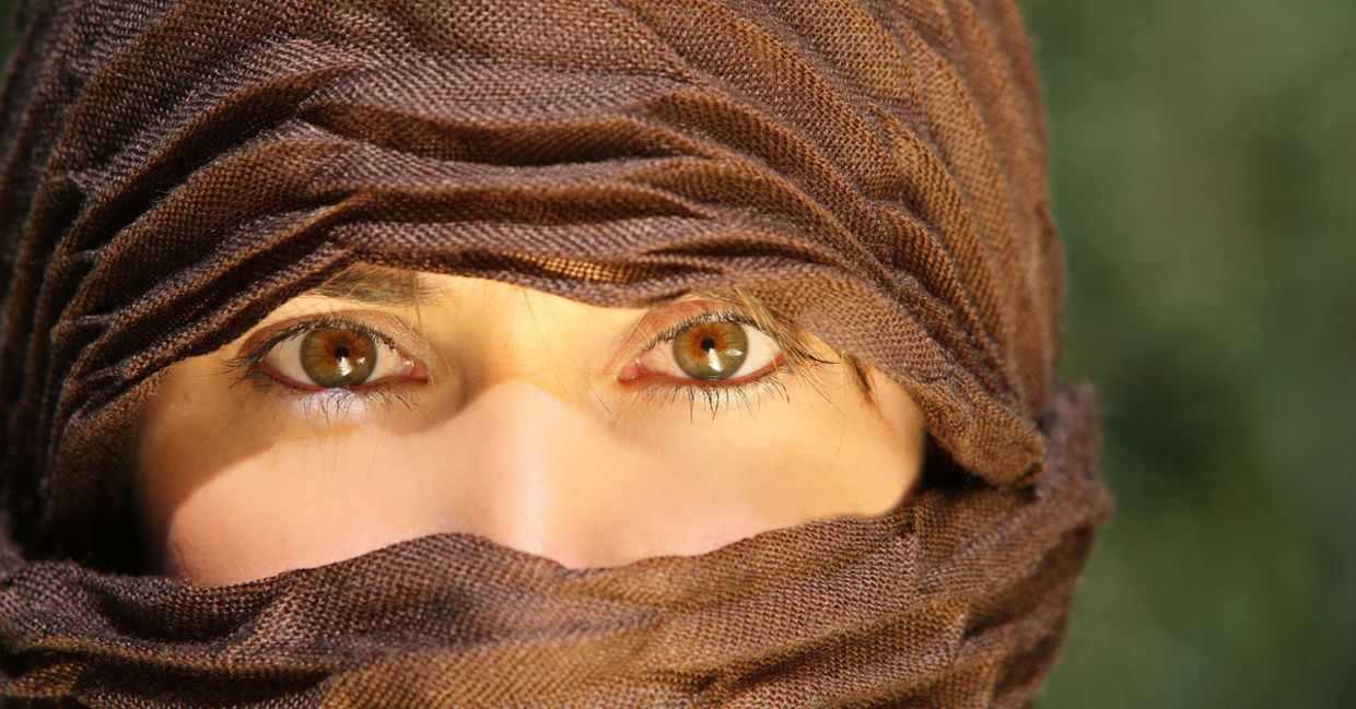 Veiled woman working outdoors Veiled woman working outdoors