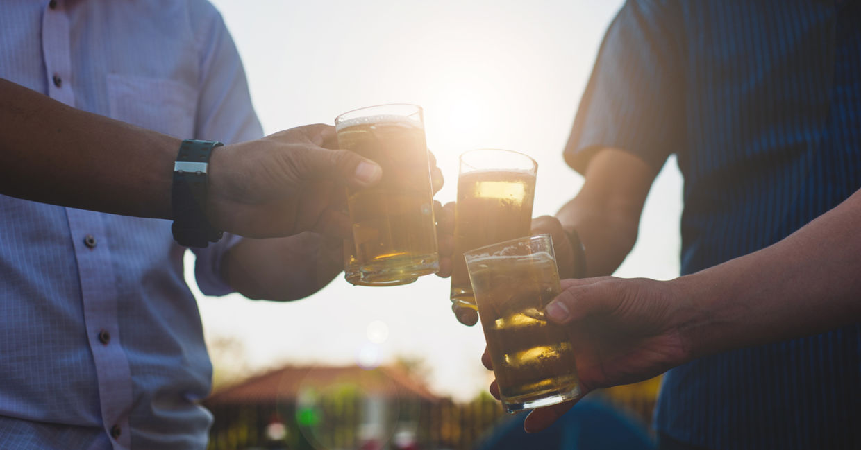 Colleagues drinking a beer together Colleagues drinking a beer together