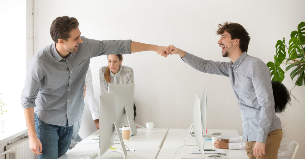 Colleagues congratulating each other Colleagues congratulating each other