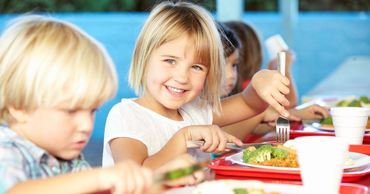 Little girl eating a healthy school lunch Little girl eating a healthy school lunch
