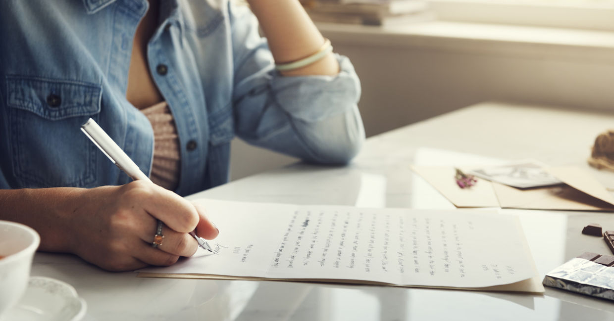 A woman writing a letter A woman writing a letter