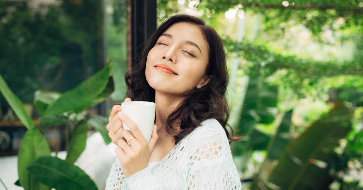 A woman enjoys her morning coffee A woman enjoys her morning coffee