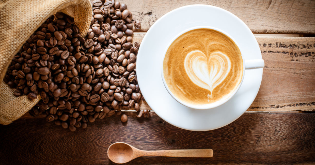 Coffee cup and beans. Coffee cup and beans.