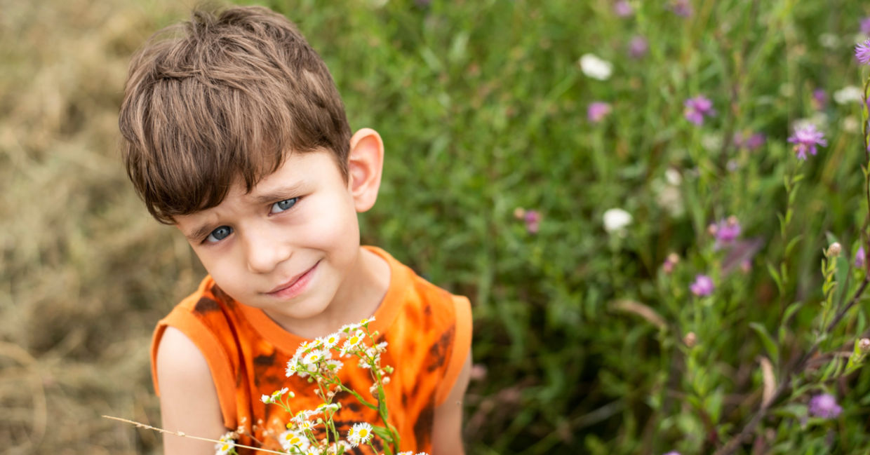 Boy giving mom flowers. Boy giving mom flowers.