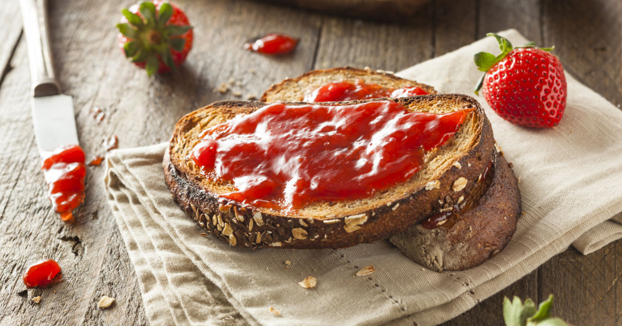 Strawberry preserves on whole grain bread is full of fiber. Strawberry preserves on whole grain bread is full of fiber.
