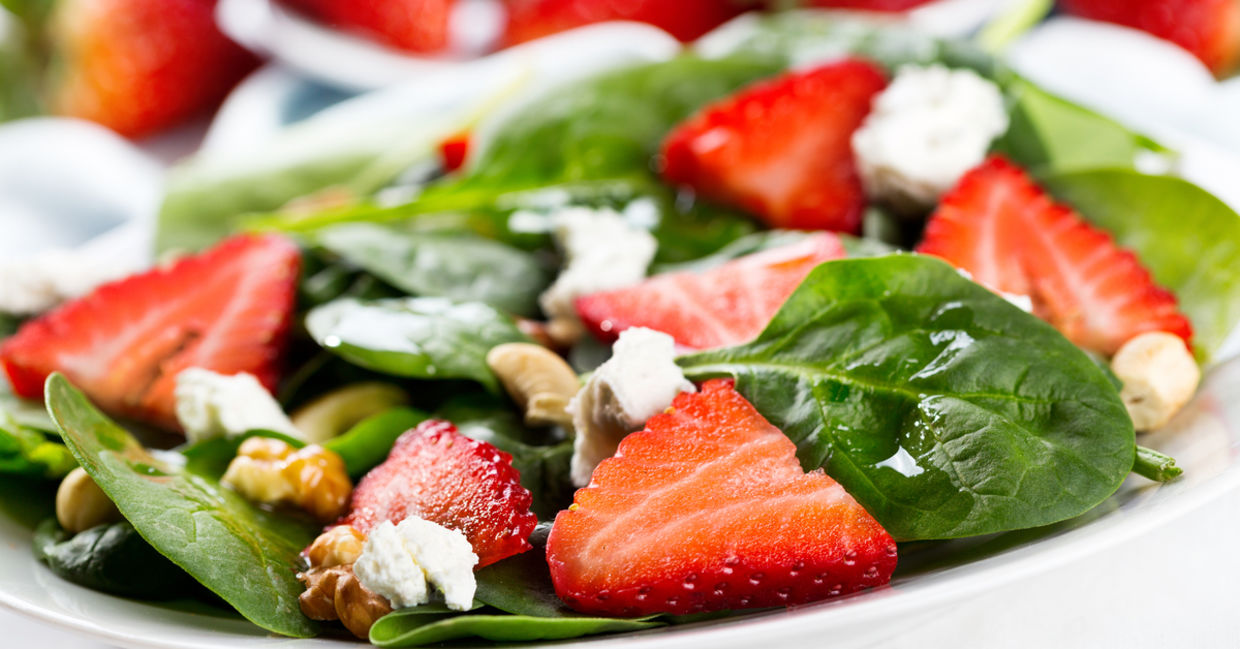 A healthy green salad with strawberries. A healthy green salad with strawberries.