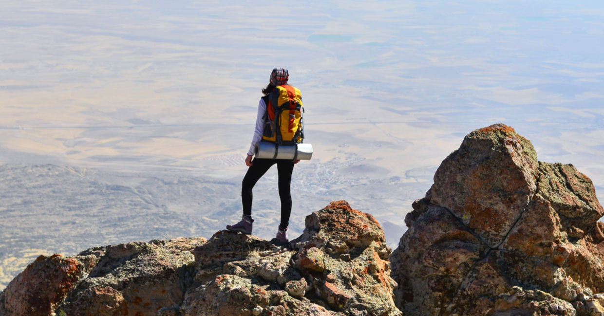 Self-confident woman makes it to the summit. Self-confident woman makes it to the summit.