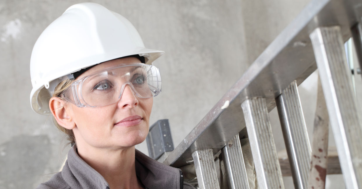 Woman wearing proper eye safety equipment to avoid injuries. Woman wearing proper eye safety equipment to avoid injuries.