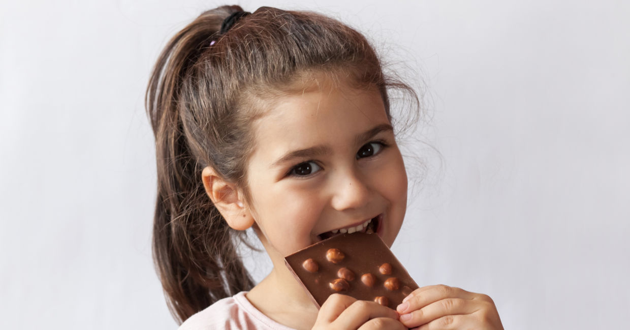 Girl enjoying chocolate. Girl enjoying chocolate.