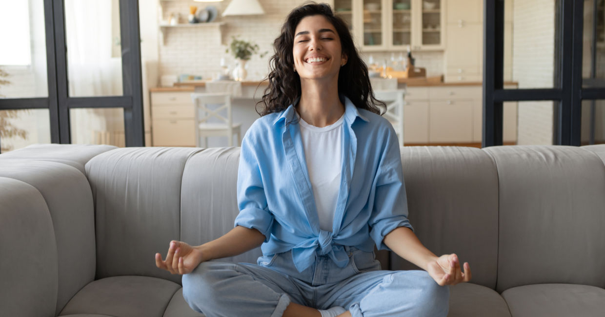 A woman is practicing mindfulness and feeling joyful. A woman is practicing mindfulness and feeling joyful.