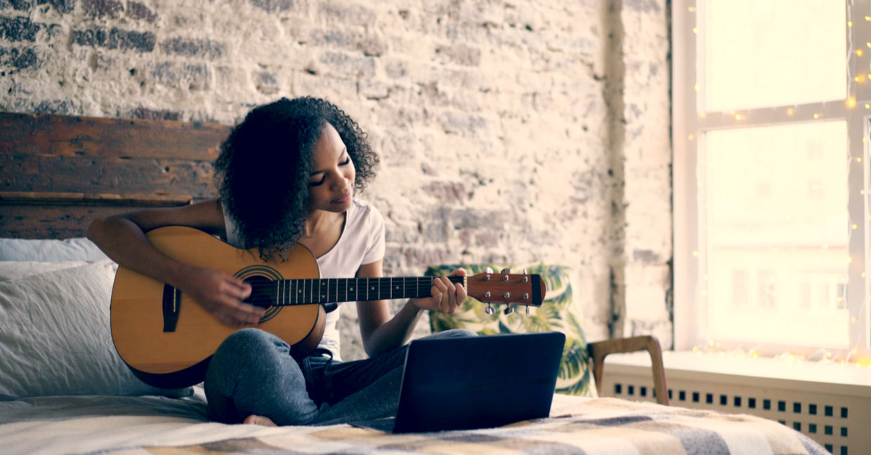 Teenager enjoying playing the guitar Teenager enjoying playing the guitar