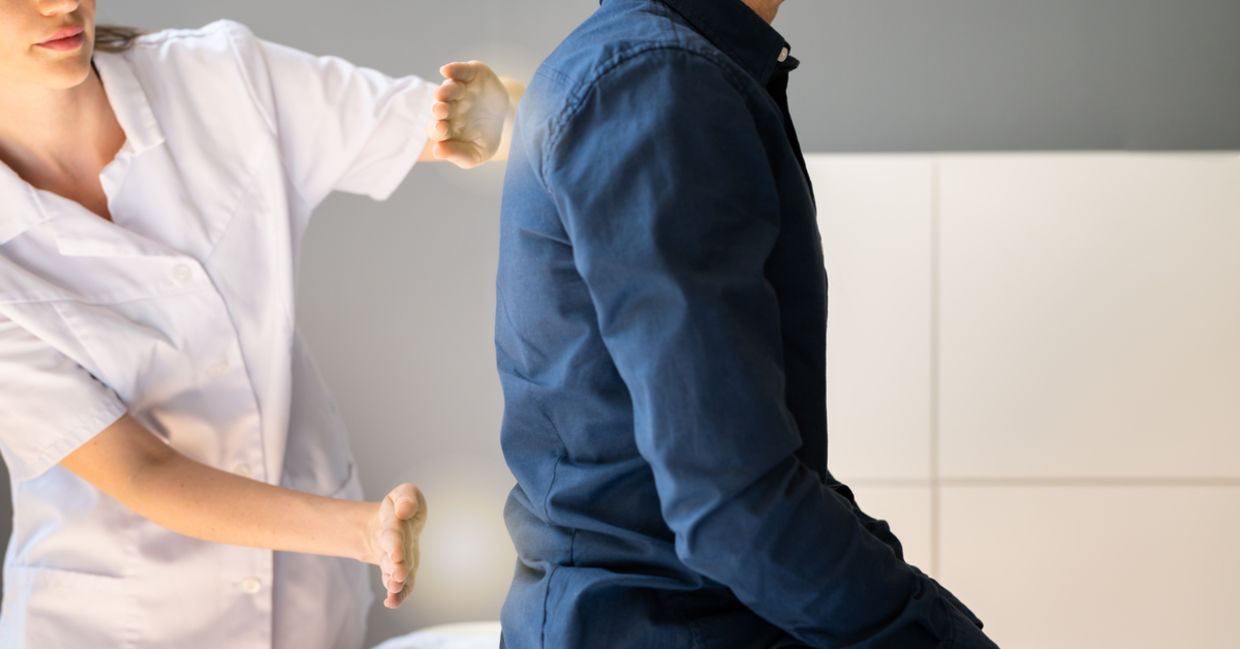 A man receives reiki for pain and mobility. A man receives reiki for pain and mobility.