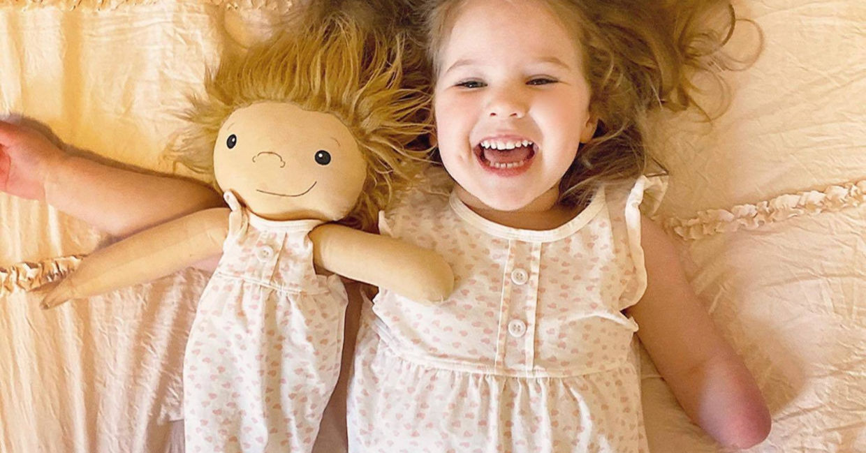 Girl playing with her customized doll thanks to Amy Jandrisevits of A Doll Like Me Girl playing with her customized doll thanks to Amy Jandrisevits of A Doll Like Me
