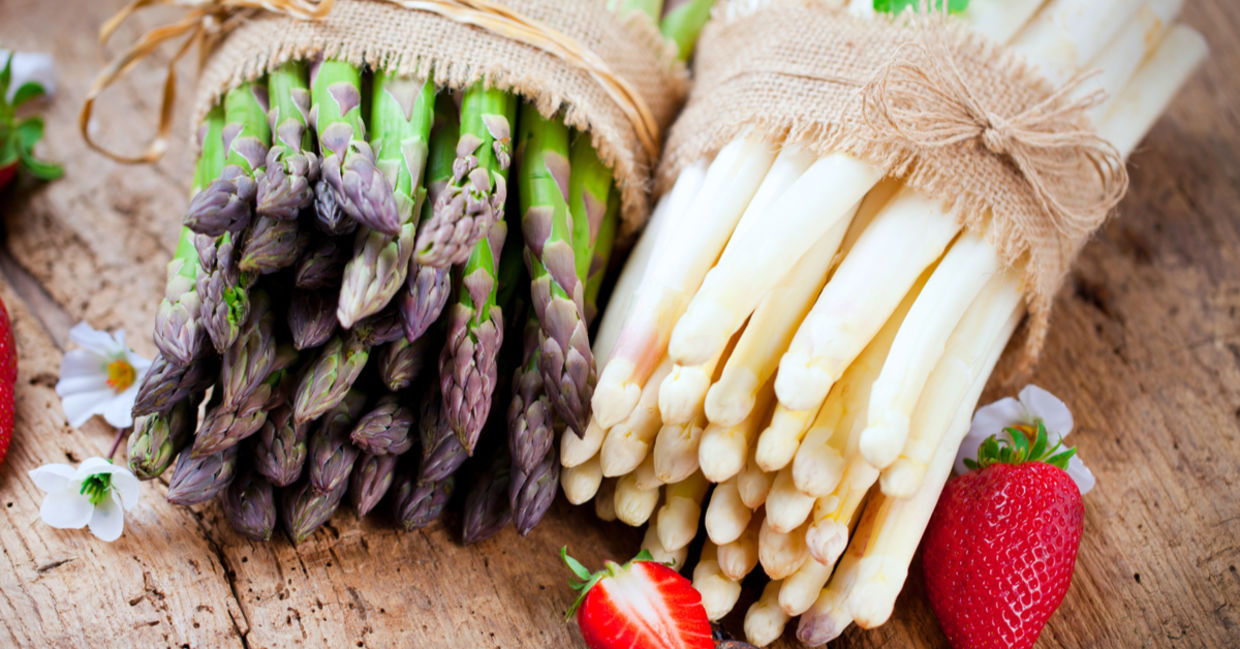 Bunches of fresh green and white asparagus. Bunches of fresh green and white asparagus.