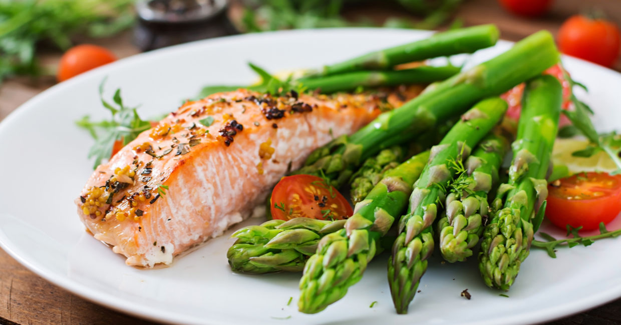 Baked salmon served with healthy asparagus. Baked salmon served with healthy asparagus.