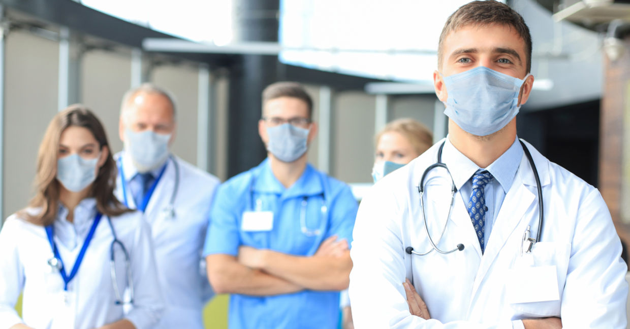 Photo of a group of doctors happy to help others. Photo of a group of doctors happy to help others.