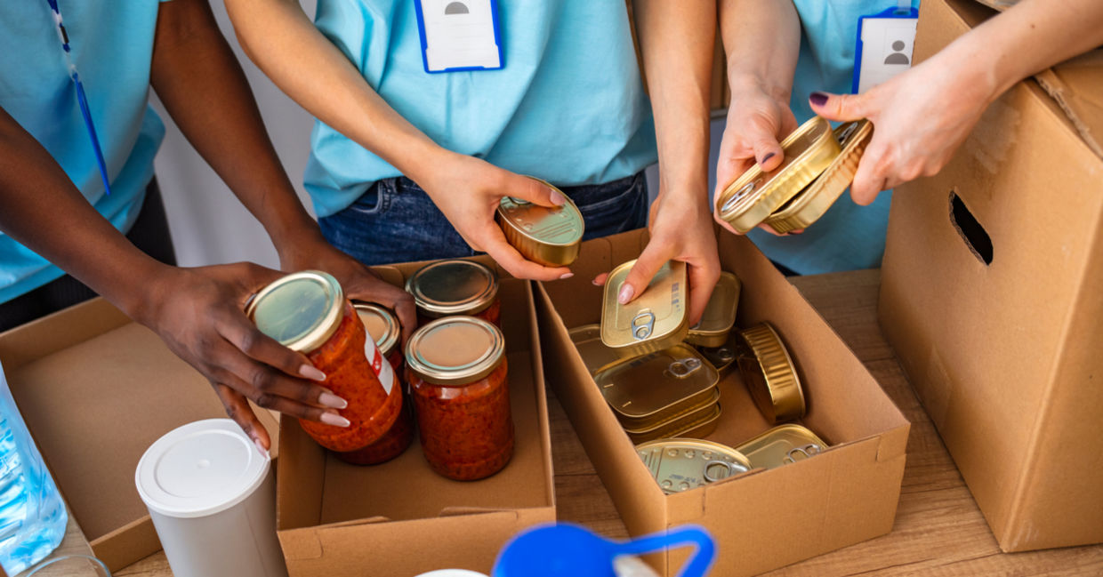Small group of volunteers working to help others. Small group of volunteers working to help others.