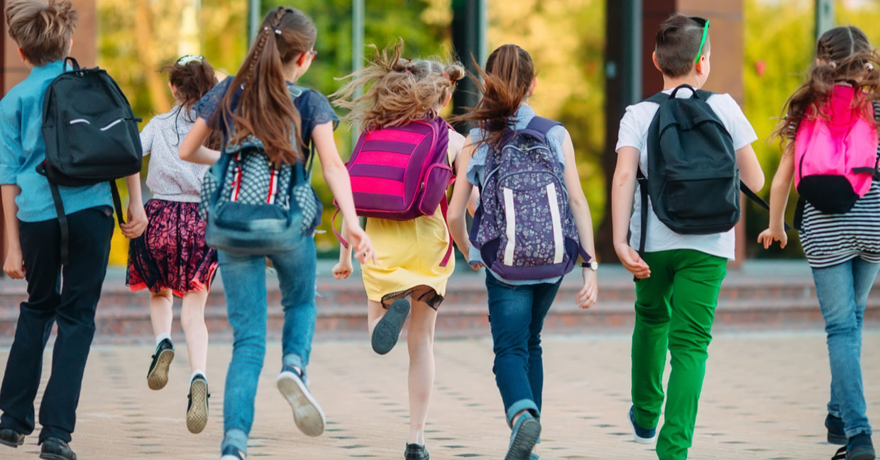 Group of kids going to school together. Group of kids going to school together.