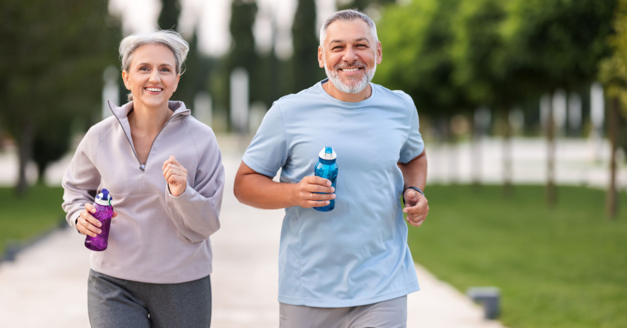 Couple jogging in city park. Couple jogging in city park.