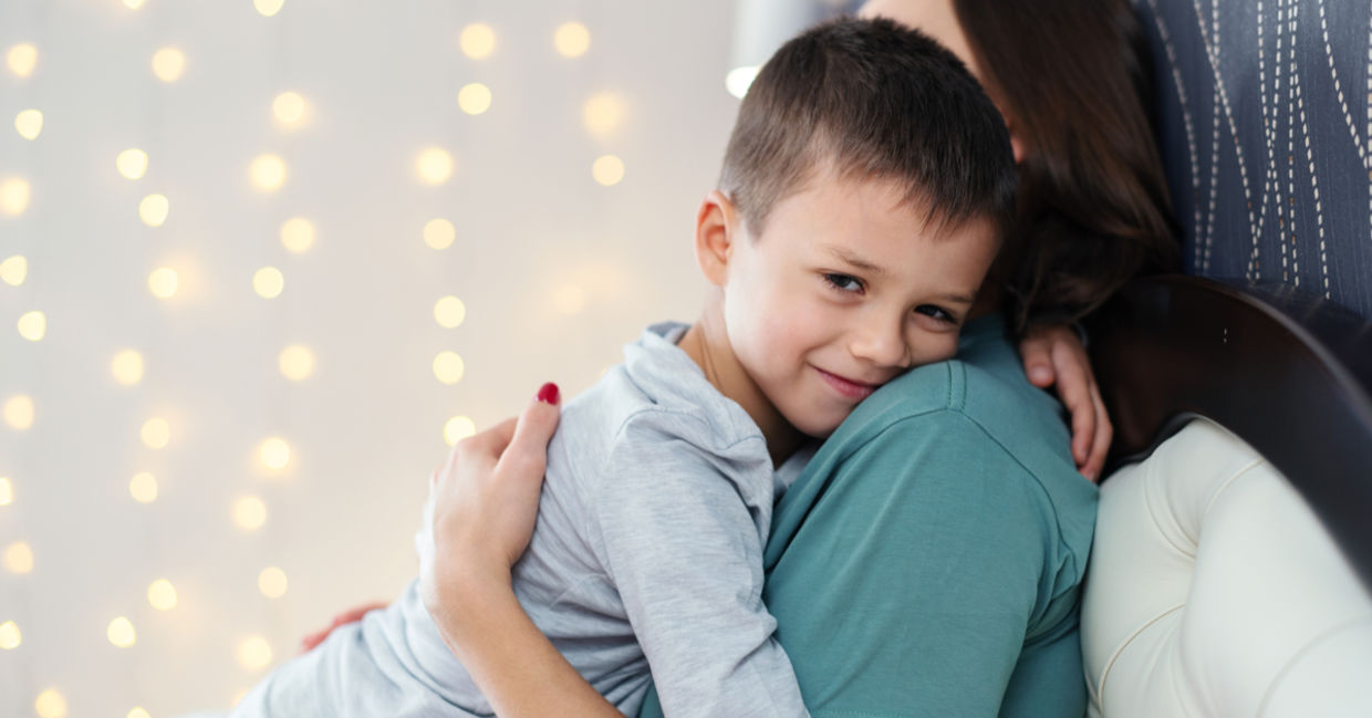 Boy hugging his mom. Boy hugging his mom.
