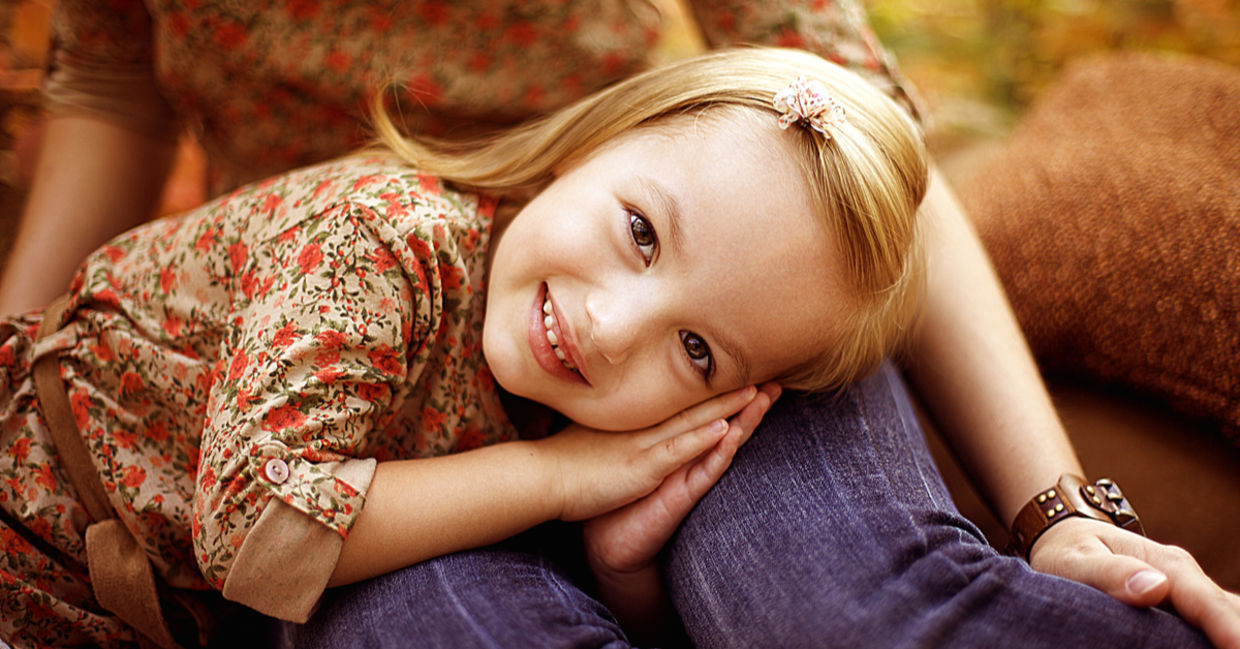 Little girl with her mother outdoors in the autumn. Little girl with her mother outdoors in the autumn.