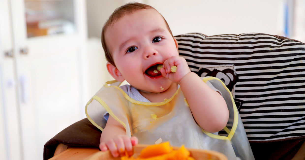 Cute baby eating cooked vegetables. Cute baby eating cooked vegetables.