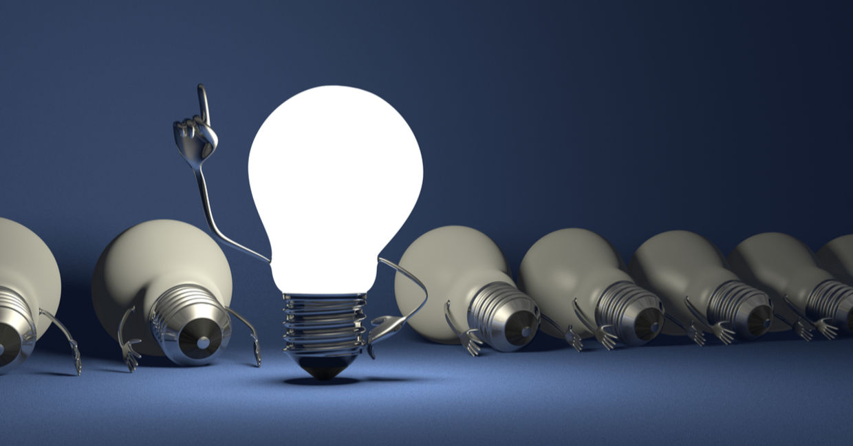 Glowing light bulb character in moment of insight. Glowing light bulb character in moment of insight.