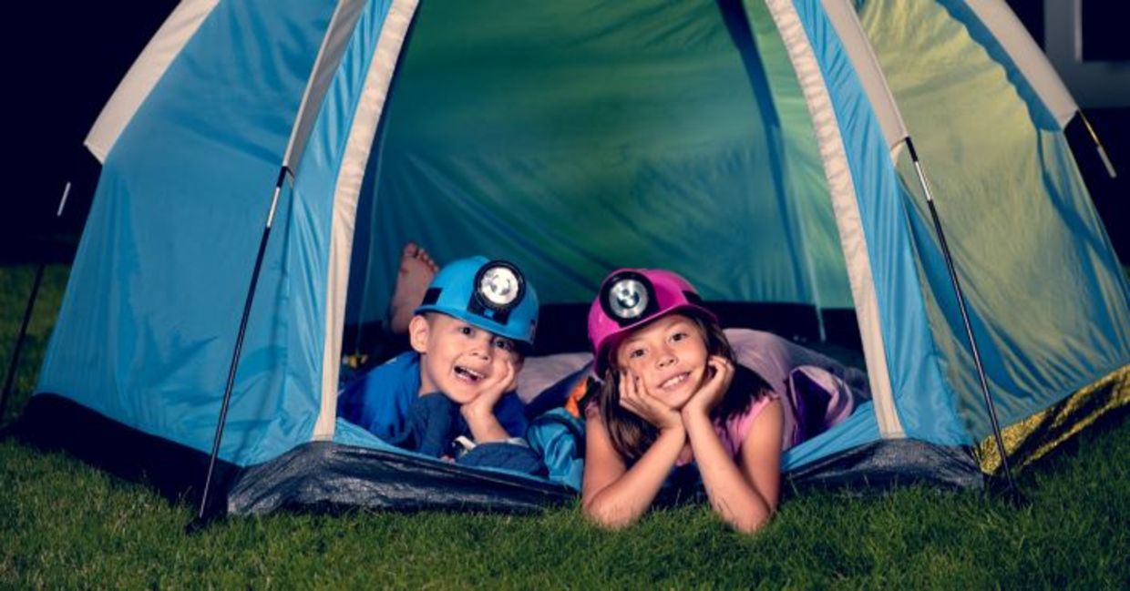 Kids camping in their backyard. Kids camping in their backyard.