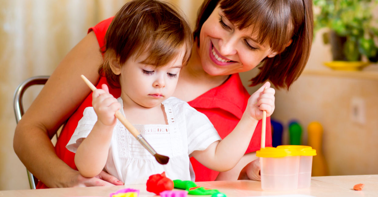 Mom and daughter painting together. Mom and daughter painting together.
