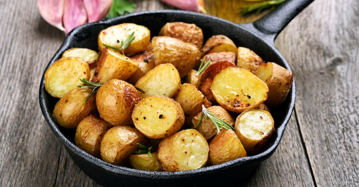 Roasted potatoes in cast iron cookware. Roasted potatoes in cast iron cookware.