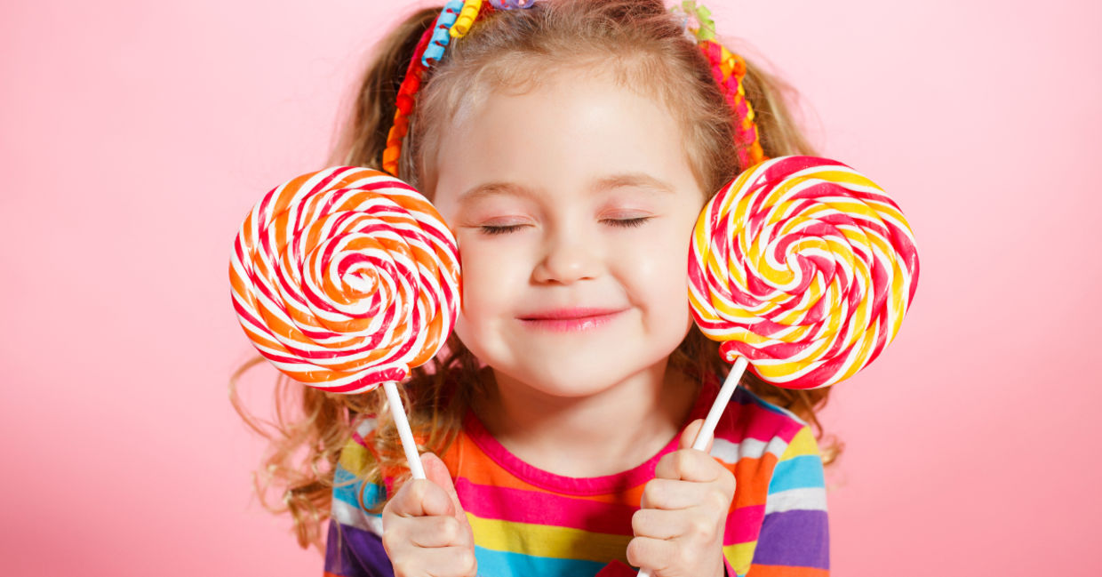 Happy child with candy lollipops. Happy child with candy lollipops.