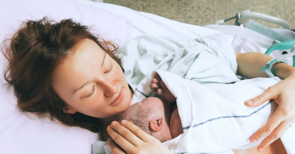Mother cuddling her newborn baby. Mother cuddling her newborn baby.