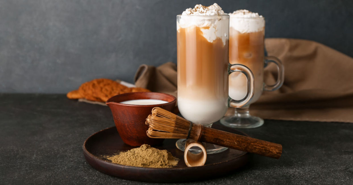 A glass of iced hojicha latte. A glass of iced hojicha latte.