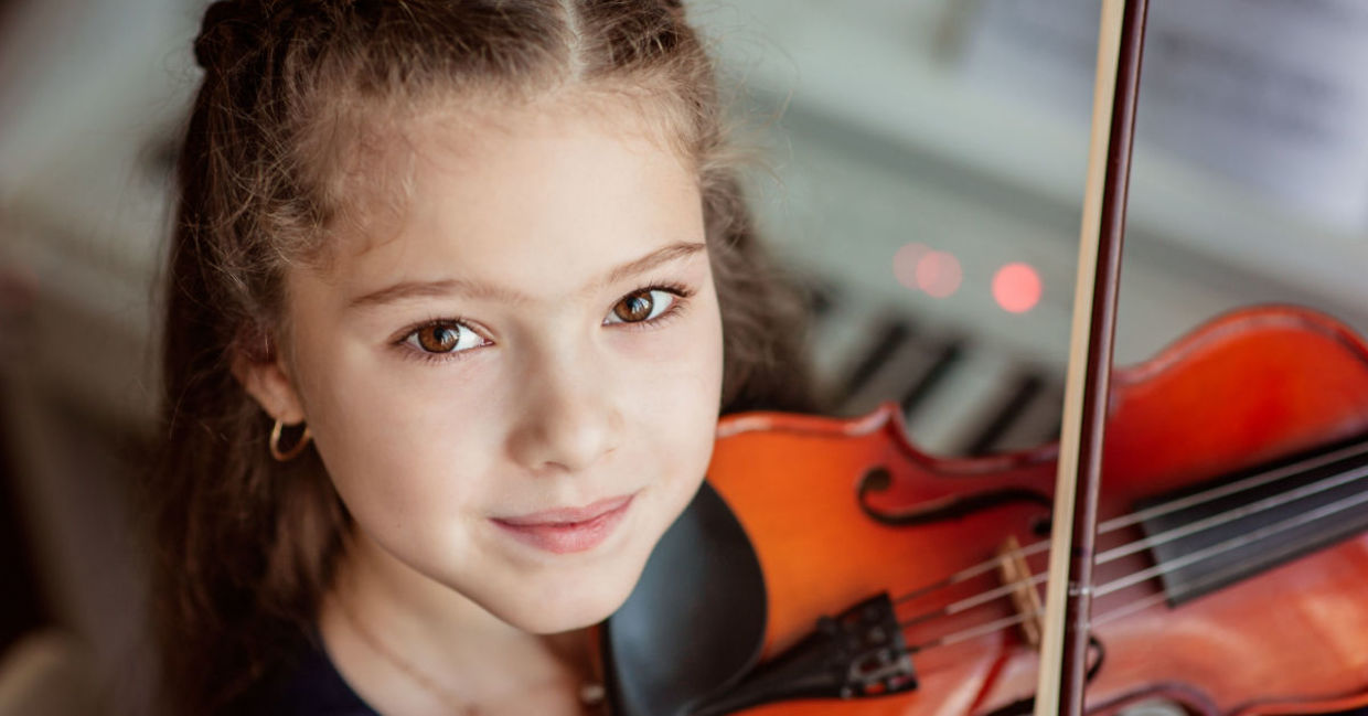 Young girl playing the violin. Young girl playing the violin.