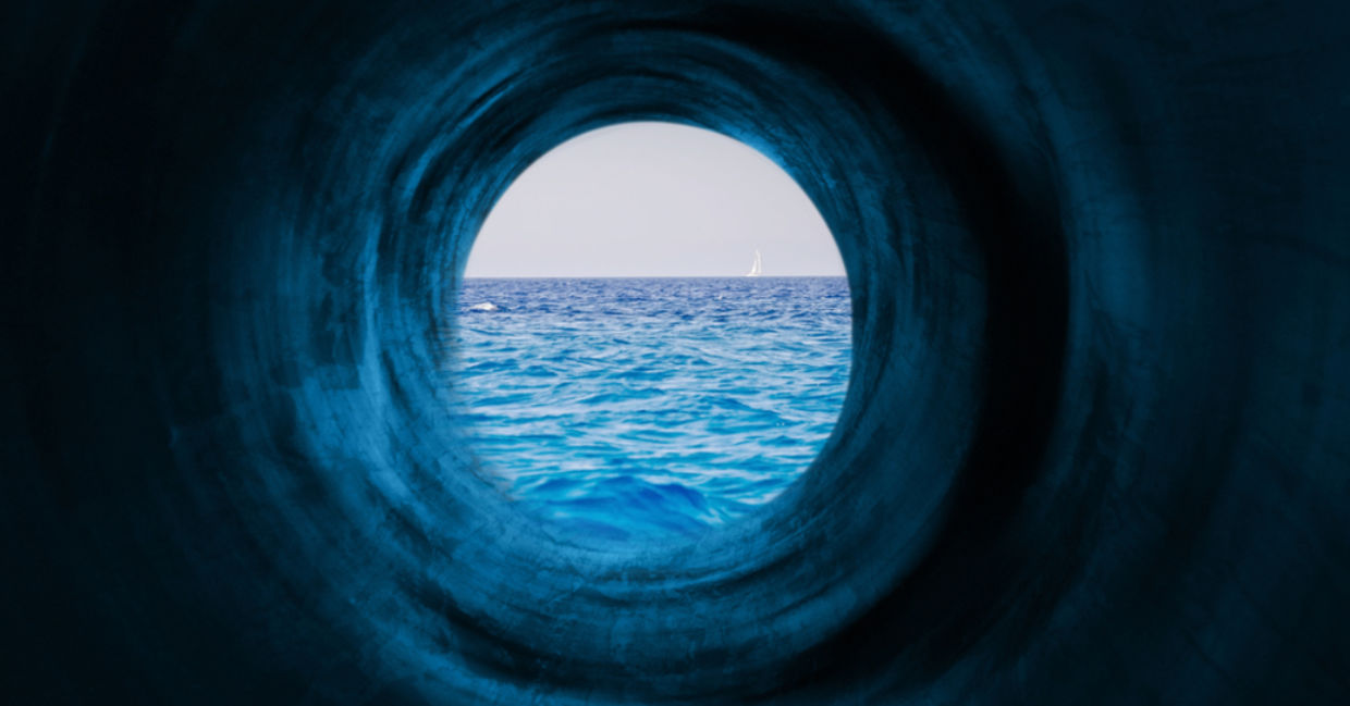 Blue tunnel to a calm sea symbolizing the way to tranquility and goals. Blue tunnel to a calm sea symbolizing the way to tranquility and goals.